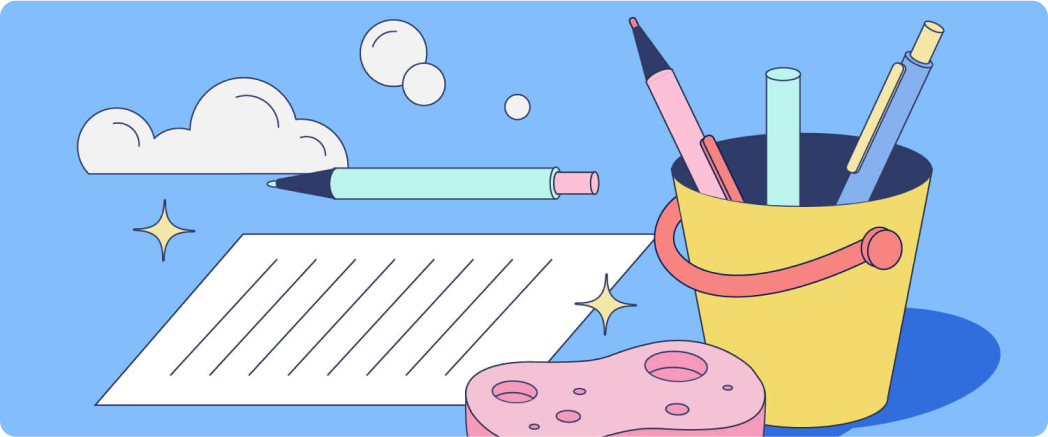A bucket filled with pens and pencils. A sponge sits next to a sparkling piece of paper.