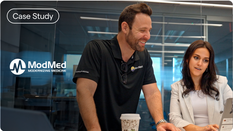 Mod Med logo with two people standing and talking