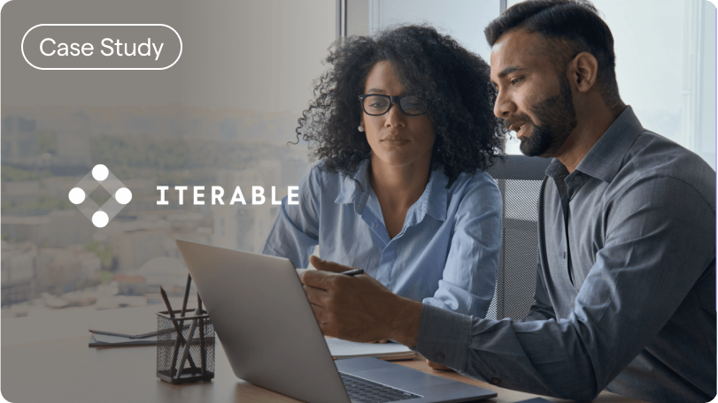 Two people looking at a laptop together