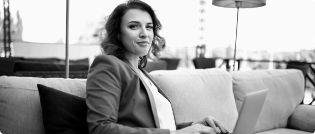 Person sitting on couch with laptop