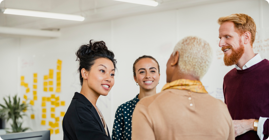 Group of people talking and smiling