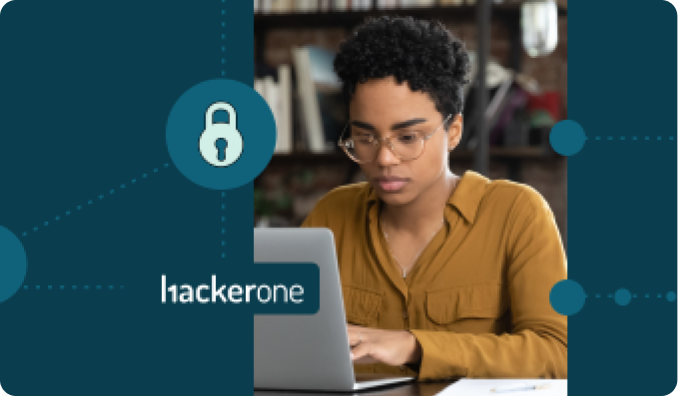Woman typing on a computer with the HackerOne logo
