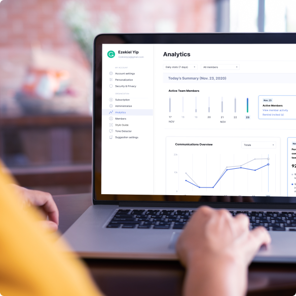 Person sitting at laptop viewing Grammarly's analytics dashboard