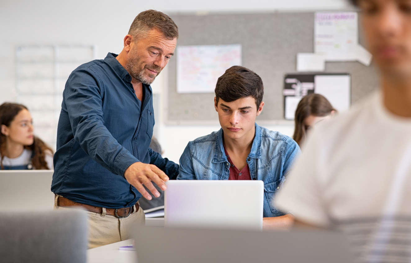 Two people talking with laptop